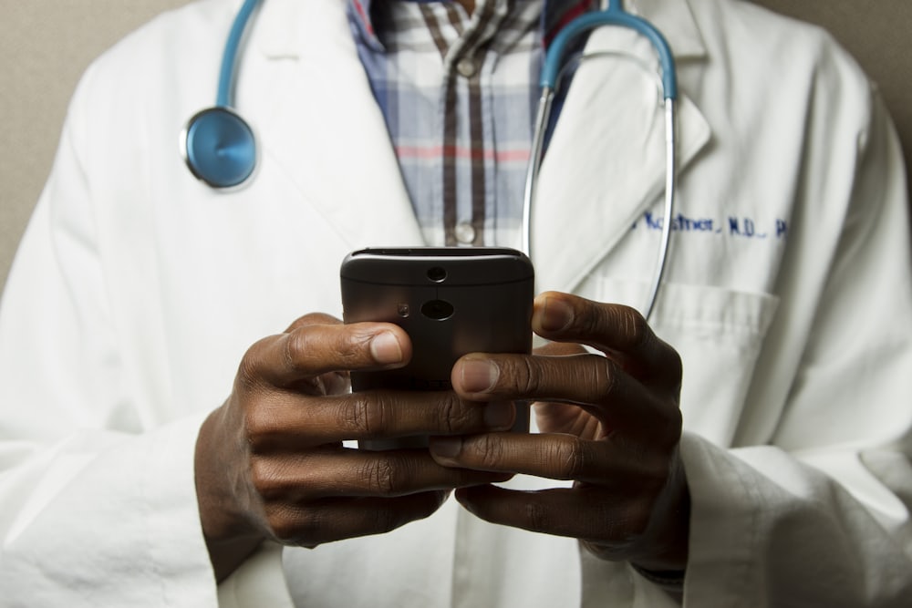 A doctor managing tasks through a personal AI agent on their phone